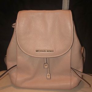 Michael Kors light pink backpack purse.